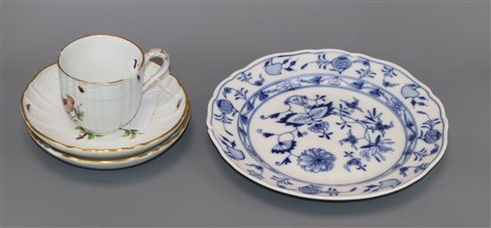 A Meissen bird painted cup and two saucers and an onion plate, 19th century